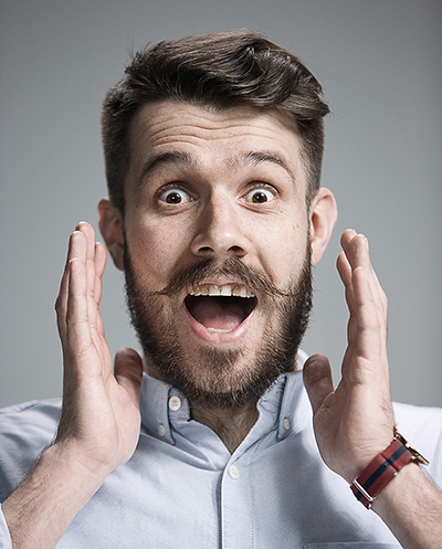 portrait-of-young-man-with-shocked-facial-P9XTN7D.jpg