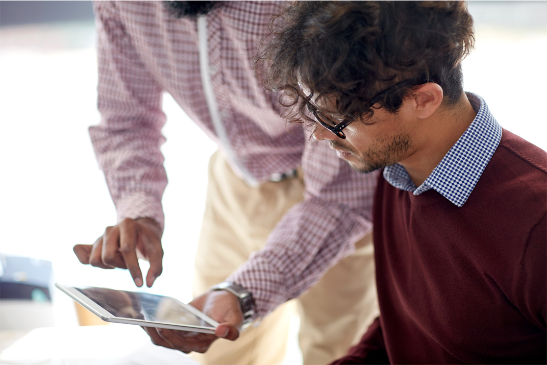 close-up-of-business-team-with-tablet-pc-at.jpg